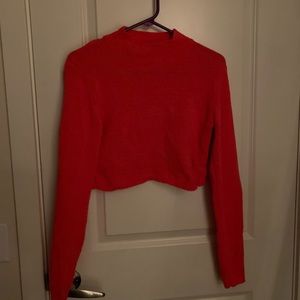 orange cropped turtleneck sweater